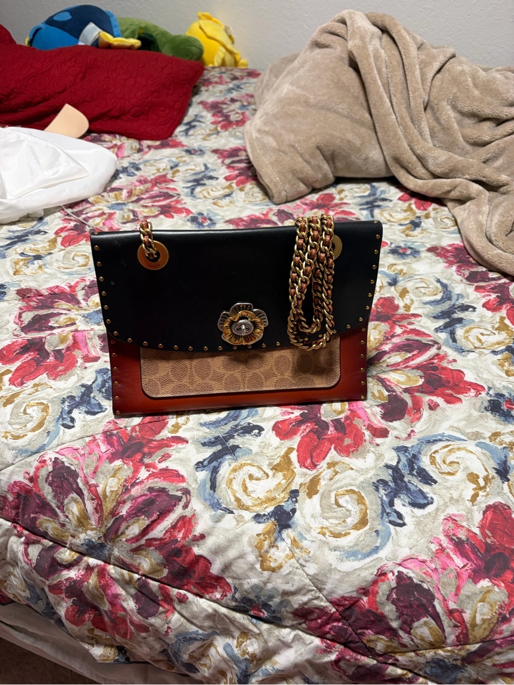Coach Parker convertible bag with mixed leather and signature.